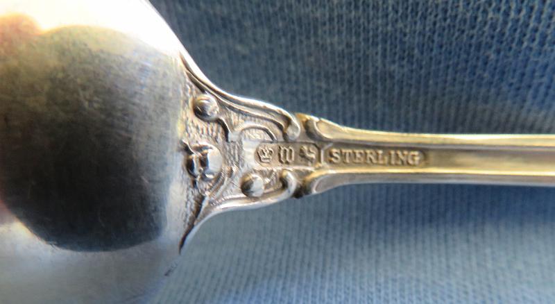 Souvenir Mining Spoon Makers Mark Davey No. 3 Mine Joplin MO.JPG - SOUVENIR MINING SPOON, TRI-STATE MINING DISTRICT DAVEY NO. 3 MINE JOPLIN MO - Sterling silver spoon, 5 5/8 in. long, engraved mining scene of mine buildings in bowl, handle open design at top, bowl marked DAVEY NO. 3 MINE, JOPLIN MO. reverse marked with maker’s mark and Sterling, ca.1910  [The Davey No. 3 mine is typical of hundreds of lead and zinc mines located throughout the nearly 2500 square miles of the Tri-State Mining District. The Tri-State district was a historic lead-zinc mining district located in southwest Missouri, southeast Kansas and northeast Oklahoma. The Davey mines were operated by the American Lead, Zinc and Smelting Company with general offices in Boston, MA.  The company was incorporated on January 26, 1899 in Maine and by 1919 owned 2,160 acres of mineral land in the Joplin district and leased another 655 acres of land owned by the Davey family which included four Davey mines.  As of 1919, two of the mines were producing and two others were worked out.  The Tri-State Mining District produced lead and zinc for over 100 years. Production began in the 1850s and 1860s in the Joplin - Granby area of Jasper and Newton counties of southwest Missouri. By the turn of the century Joplin with a population of 26,000 was quickly becoming the center of the mining activity for the Tri-State Mining District. The value of Tri-State mineral production from 1850 to 1950 exceeded one billion dollars.  Until 1945, the region was rated as the leading producer of lead and zinc concentrates in the world, accounting for one-half of the zinc and ten percent of the lead produced in the United States. Production continued until the closure of the Picher, Oklahoma mines in 1967, and the Swalley mine near Baxter Springs, Kansas in 1970. The Tri-State district includes three mining-related Superfund sites: the Tar Creek Superfund site in Oklahoma; the Jasper County and Newton County sites in Missouri; and the Cherokee County site in Kansas.]
